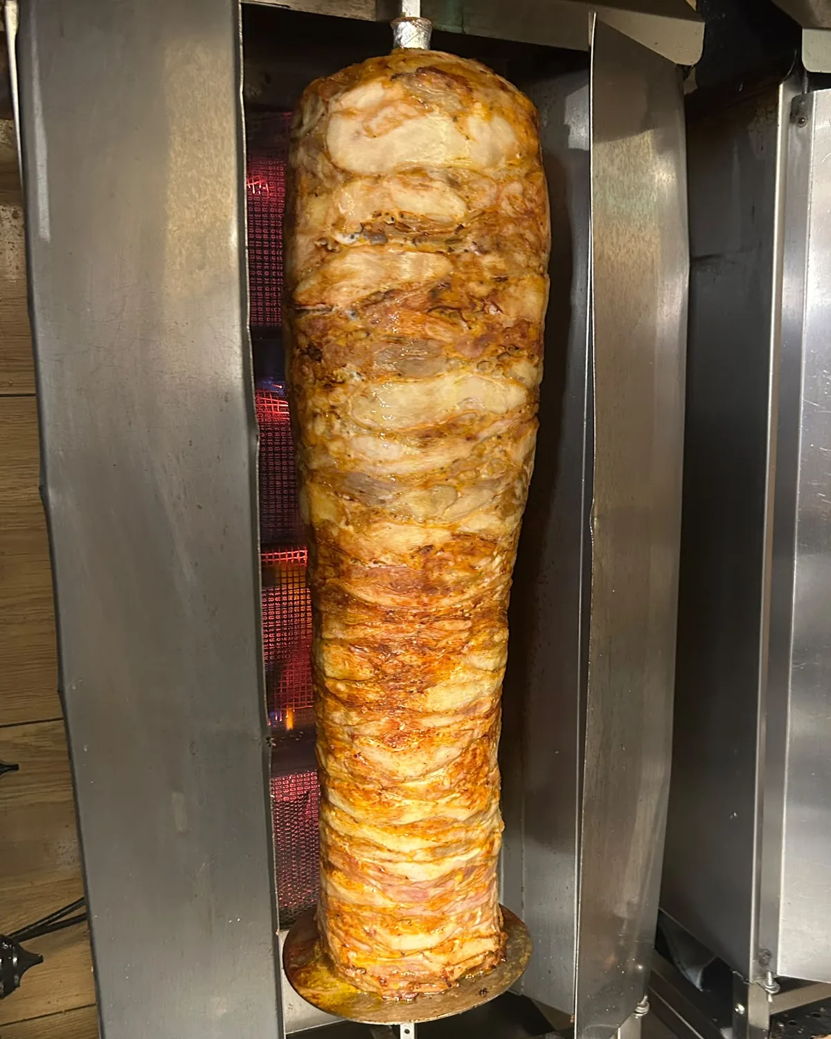Roasted meat on a spit in the grill